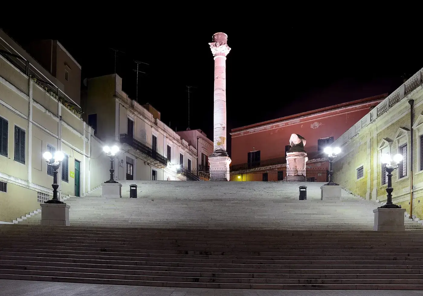 The Roman column at the end of the Via Appia in Brindisi, at night
