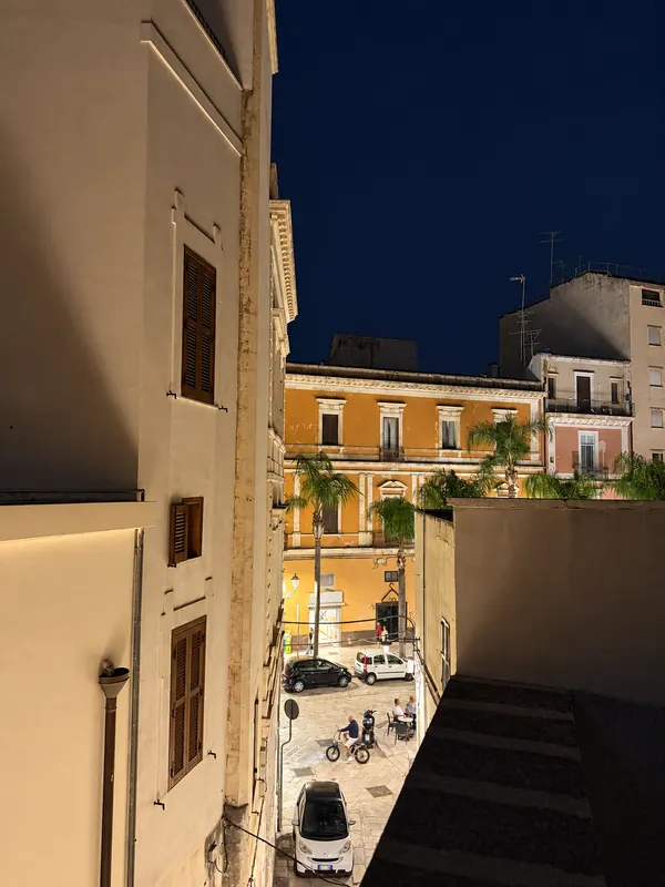 Night view over the roofs of Brindisi old town from the terrace